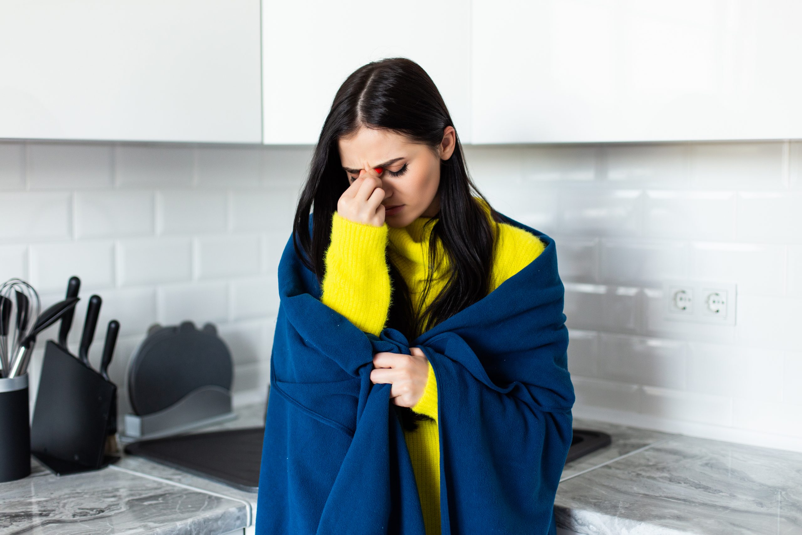 Young woman feel bad sick standing in the kitchen